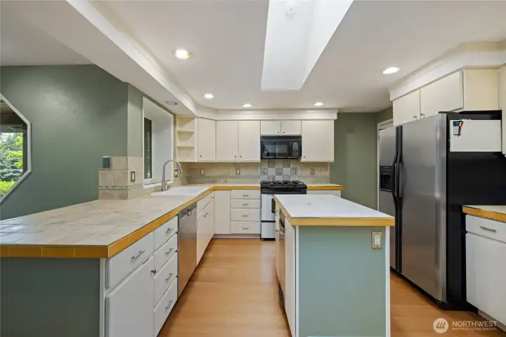 Bright kitchen with plenty storage and working space