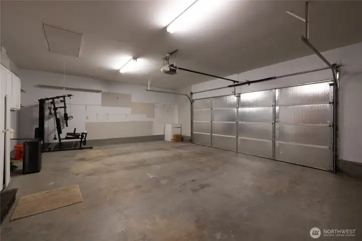 SPACIOUS 2 CAR GARAGE - FURNACE AND WATER HEATER AREA LOCATED IN THE GARAGE
