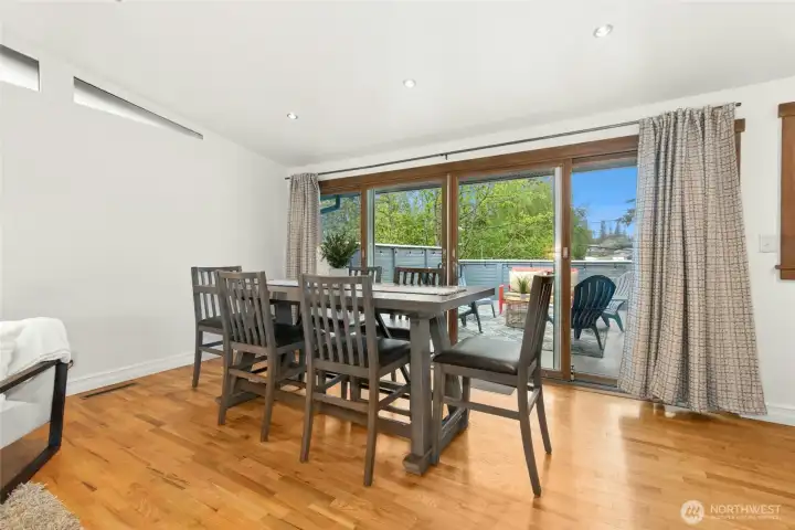 Large dining room opens to large deck thru wood framed sliding floors