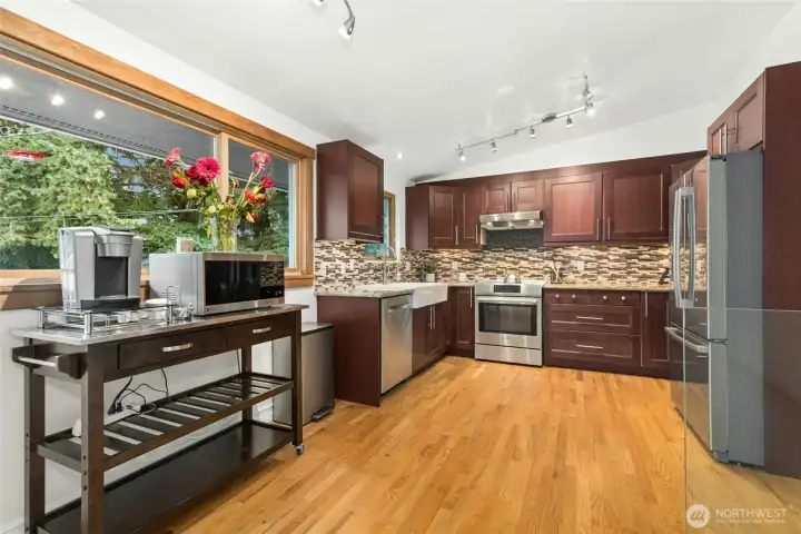picture window adds lots of light to the spacious kitchen