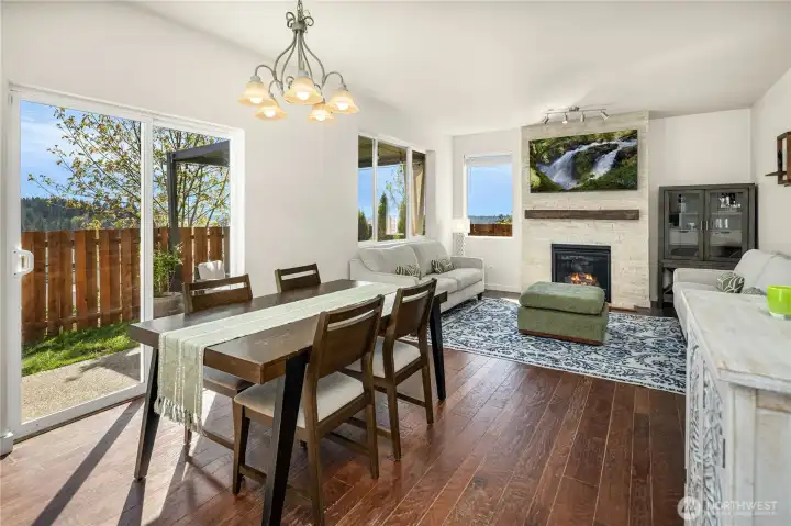 Bright open Great room and Dining area with hardwood flooring