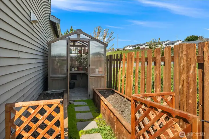 Garden area fenced and enclosed to keep pets and little ones away.