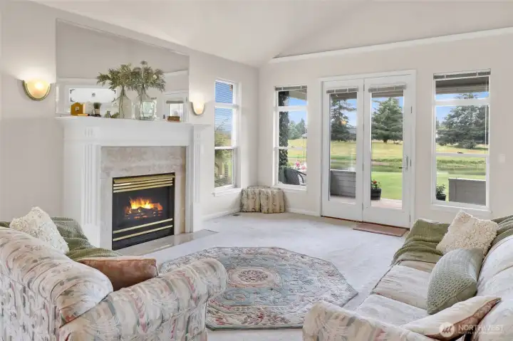 Anchoring the great room with warmth and character, the gas fireplace creates an inviting gathering place while complementing the home's open layout and tranquil pond views. Anchoring the great room with warmth and character, the gas fireplace creates an inviting gathering place while complementing the home's open layout and tranquil pond views.