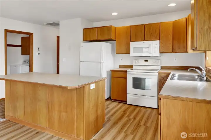 With plenty of workspace and a functional layout, this kitchen is as practical as it is inviting. With plenty of workspace and a functional layout, this kitchen is as practical as it is inviting.