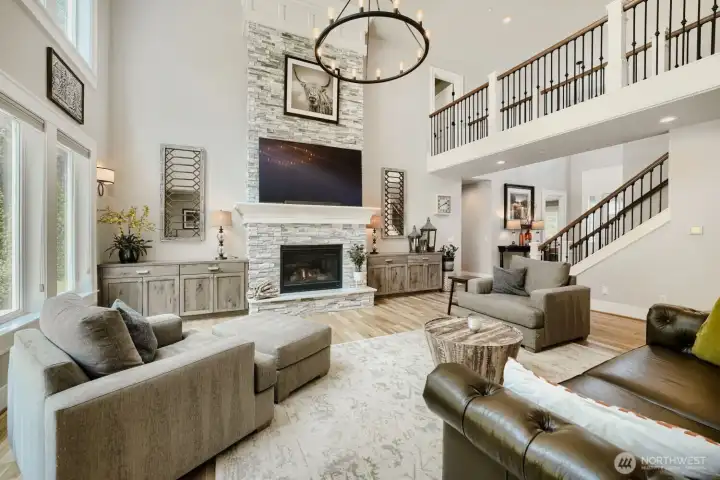 The living room features a custom built stone fireplace, built by a retired master mason. Above you will see the wrought iron skybridge. The living room features a custom built stone fireplace, built by a retired master mason. Above you will see the wrought iron skybridge.