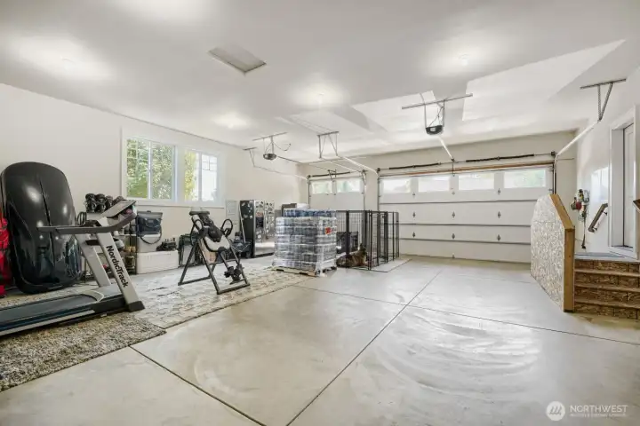 The garage can house at least 4 cars. comfortably. Enter into the utility room to the door on the right. The garage can house at least 4 cars. comfortably. Enter into the utility room to the door on the right.