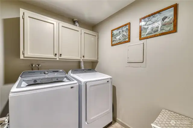 Laundry room with built in cabinets.