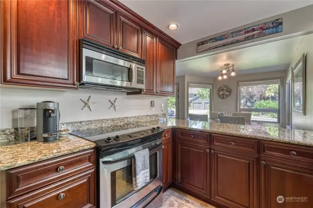 The kitchen is amazing!  Granite counter tops, stainless steel appliances and rich cherry cabinets.