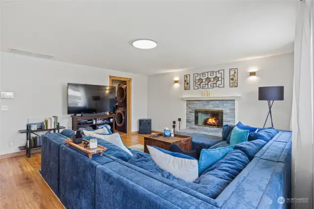 Expansive living room with gas fireplace.  Wonderful for entertaining!