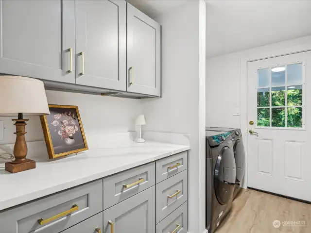 Utility room on main level with door to let in the fresh air