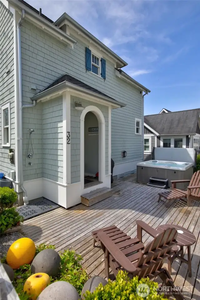 The fenced back yard offers a nice place to enjoy the outdoors and use the hot tub. Rinse the kids and dogs off with the handy outdoor shower!