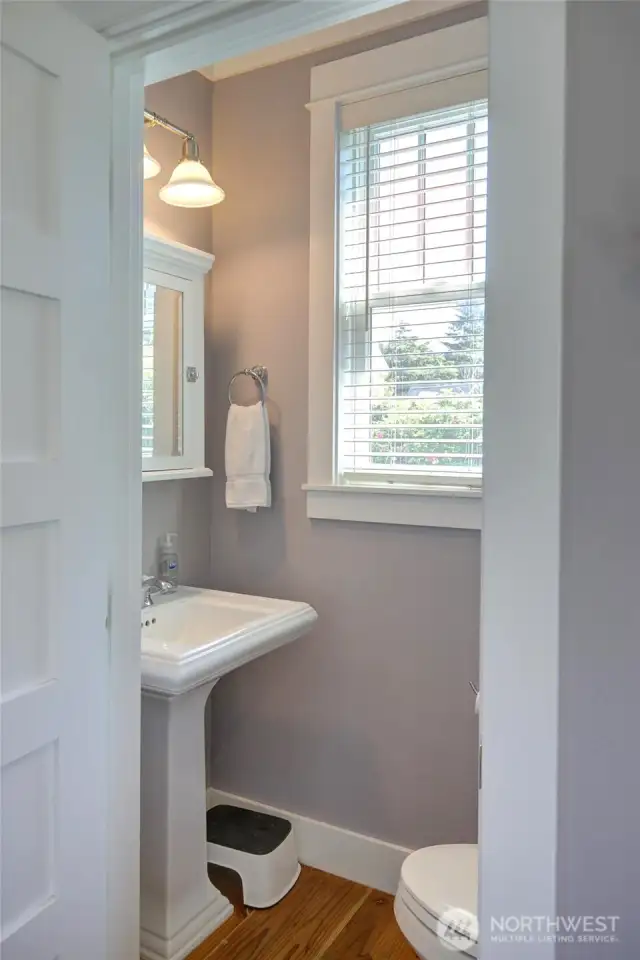 Off the back entry is small powder room.