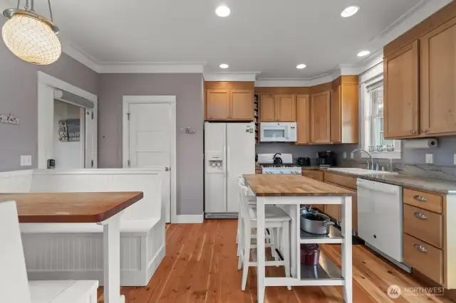 The natural cabinets and wood floors are neutral and warm.  The wood floors are scheduled to be refinished this summer!