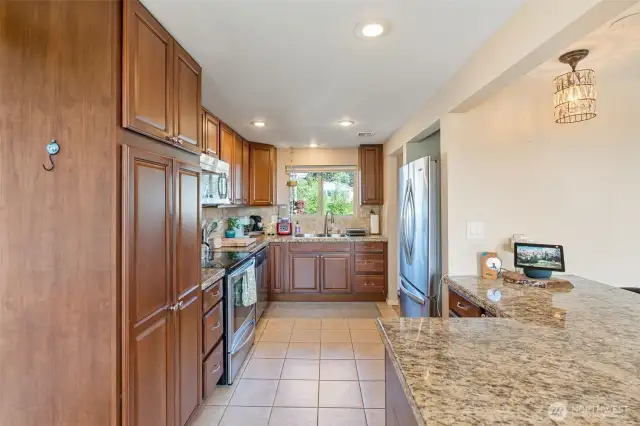 Functional kitchen with island so you'll stay connected to your guests
