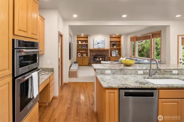 The kitchen is equipped with a convenient double oven, where the top oven also functions as both an oven and a microwave.