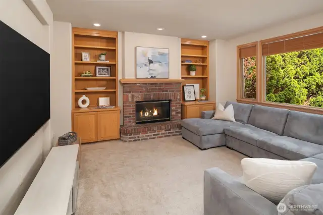 A roomy family room, made extra cozy with a wood-burning fireplace.