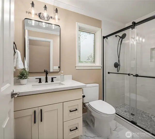 A convenient 3/4 bath adjacent to the main level bedroom/office.