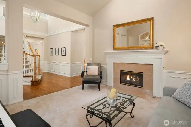 A cozy yet sophisticated living room, perfectly complemented by a warm and inviting gas fireplace.