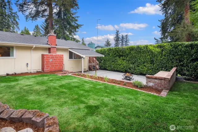 Across back lawn to house and recessed patio