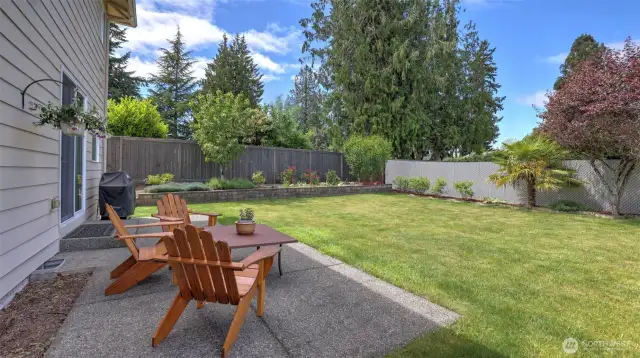 Beautifully landscaped level lot with new lawn, patio and fully fenced backyard.
