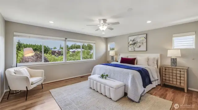 Primary suite w/ a luxurious 5-piece bath and oversized walk-in closet.