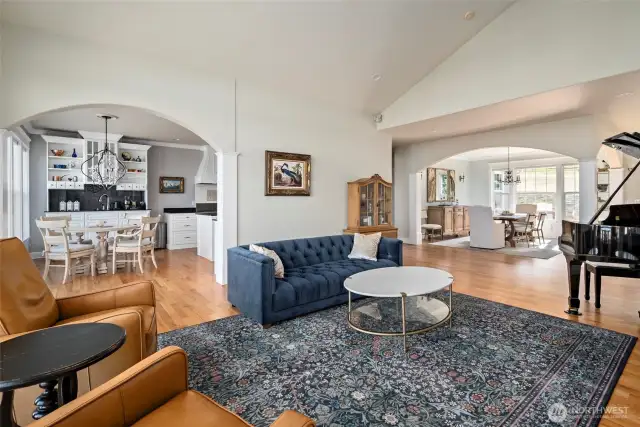 Living room looking into kitchen and into dining room. Perfect entertaining floor plan.