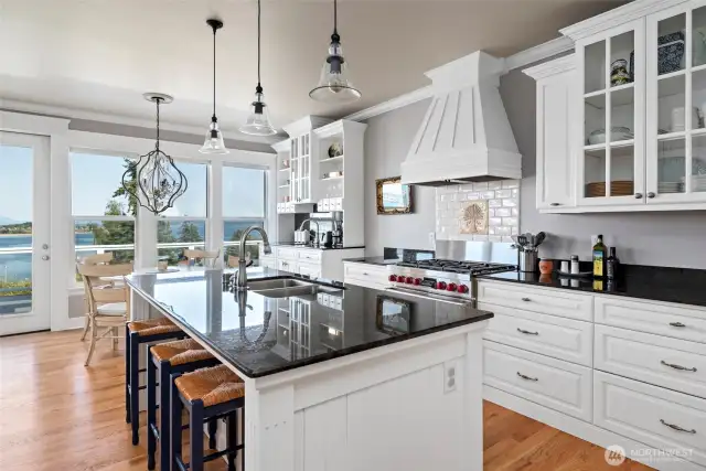 Stunning kitchen with tons of cabinet and counter space, AND a Wolf gas range for your inner chef!