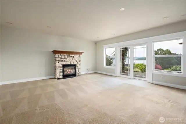 Let's head down stairs to the huge family room with slider out to the back porch and hot tub area.