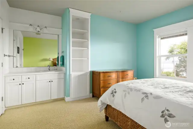 3rd bedroom downstairs with it's own sink and vanity!