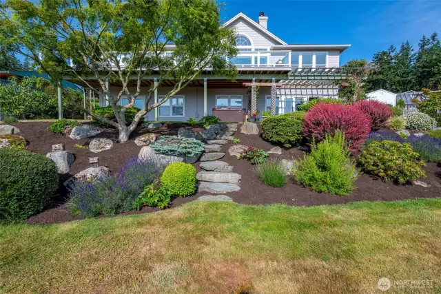 Beautifully landscaped and fenced back yard.