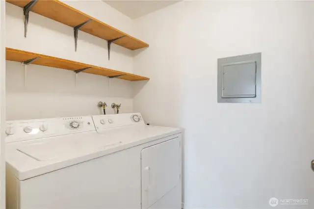Laundry room with storage shelving