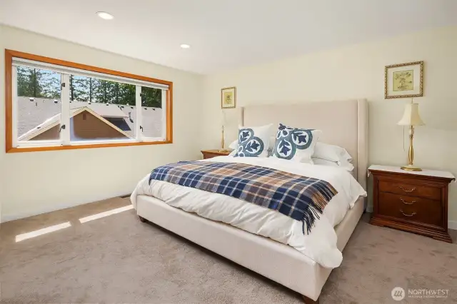 Primary bedroom with remote control blinds