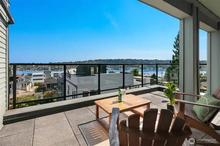 Enjoy lake, mountain & city views from huge covered wrap-around deck