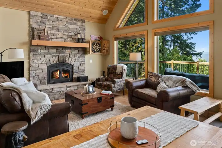 Fireplace with stone surround, hearth, and mantle.