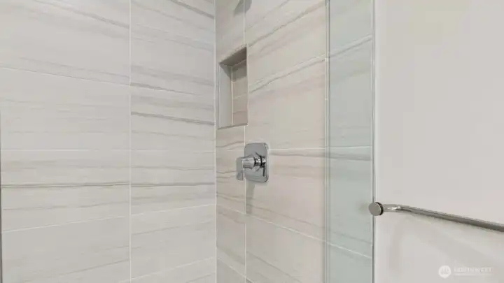 Nicely appointed shower in primary!