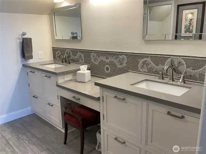 Custom-designed tile mosaic in the primary bathroom