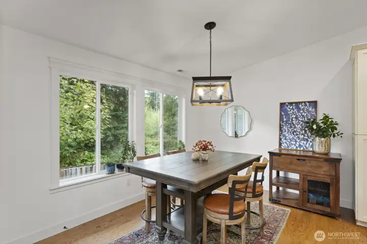 Informal dining off the huge kitchen...door to the left to deck!