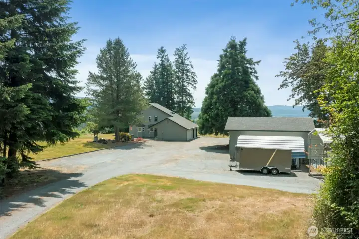 This view shows driveway entry to well maintained NW secluded country estate.