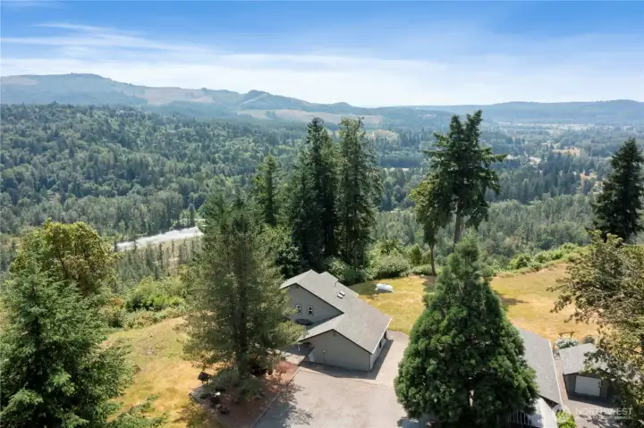 Aerial view of home facing south west of the Orting valley and the Carbon River.