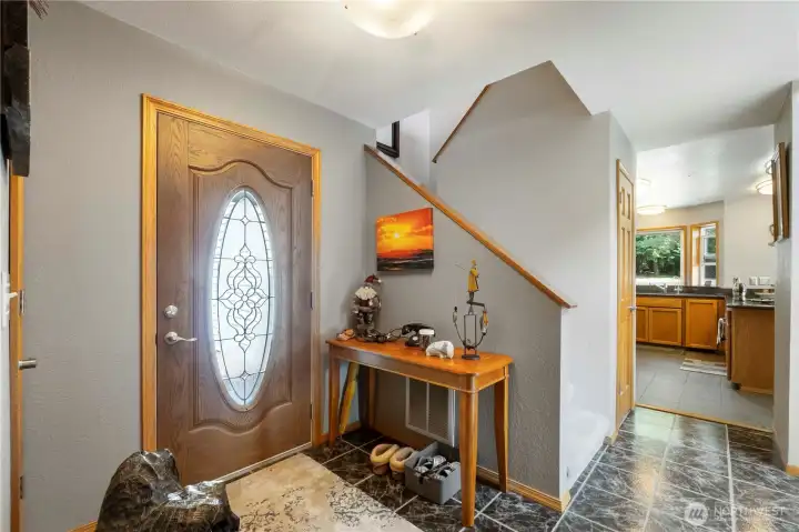 Entry way front door with view into the kitchen space.