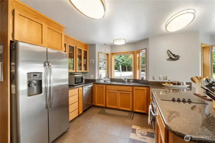 Well organized kitchen area.  Counter top is granite.