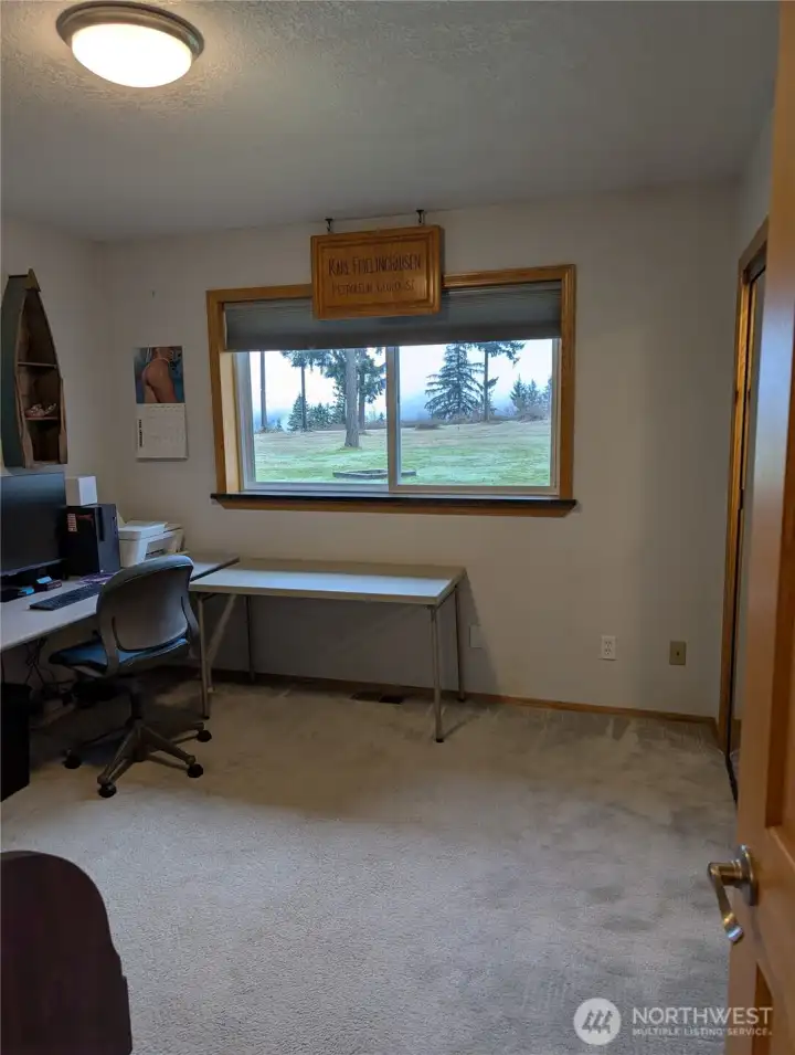 Guest Bedroom # on first floor  Closet recently upgraded with new doors and lighting.  Currently used as an office. View from this room faces southwest into Orting valley.