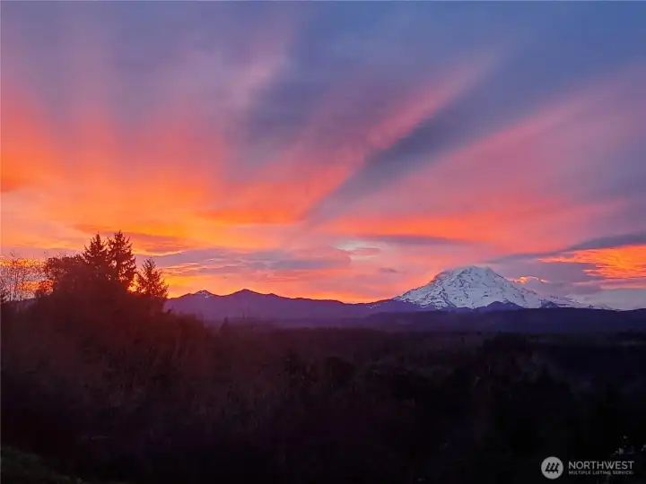 Glorious Morning Sunrise view of Mt. Rainier and lower elevation Cascade Foothills. This photo was taken from the Primary Bedroom windows second week of February 2026.