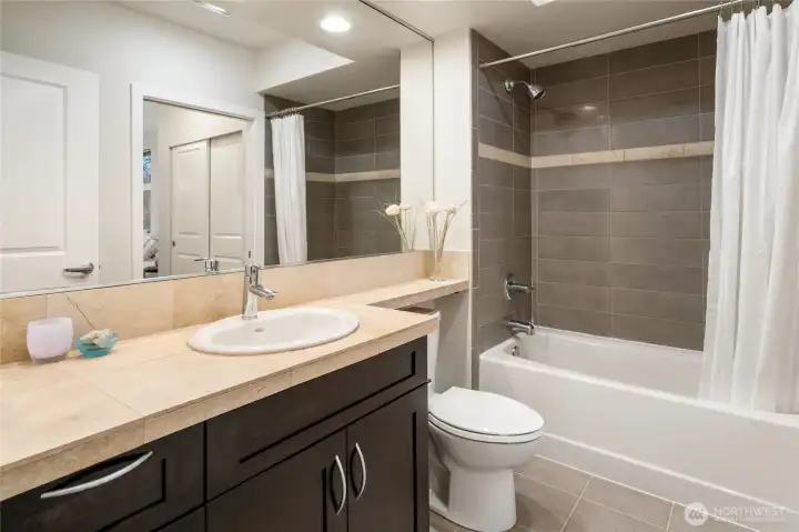 Spacious and stylish full bathroom.