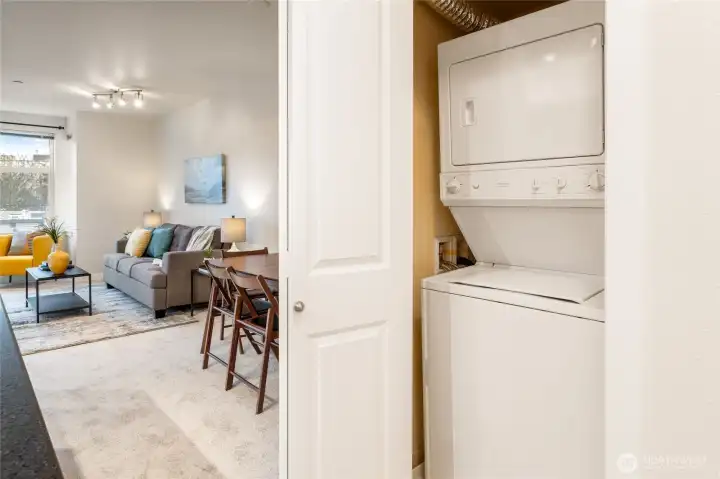 In-unit washer and dryer are tucked in a closet out of sight, and are included in the sale.