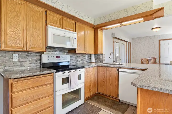 ~View of kitchen to dining room & french doors leading to back patio~