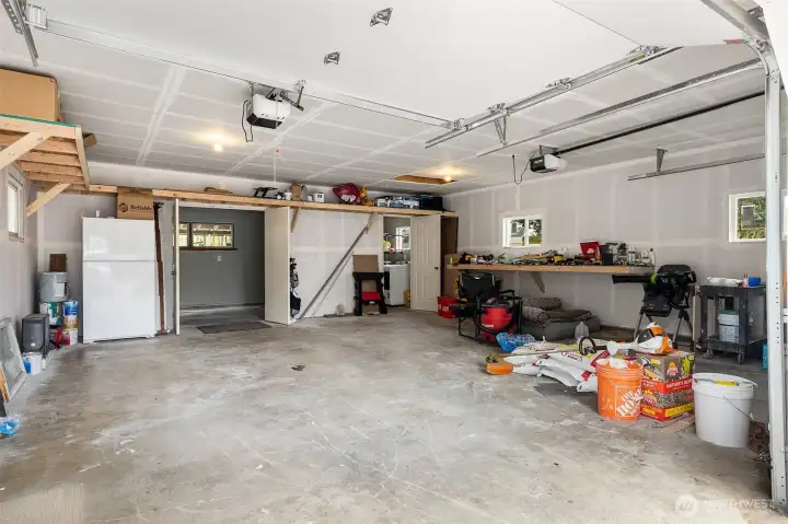 ~Spacious oversized 2 Car Garage w/ 2 Rooms ~ Utility room to the right & Work Shop/Hobby Rm to the left~ Lots of Storage~