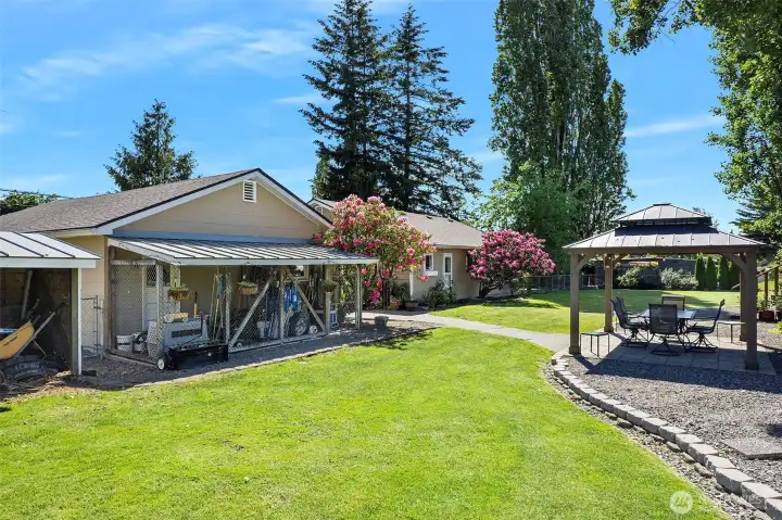 ~Back of Home with Covered Kennel Area measuring 20 Ft by 6 Ft~
