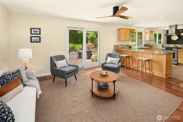 Family room off the kitchen with big eating bar for quick breakfasts or chatting with the cook.