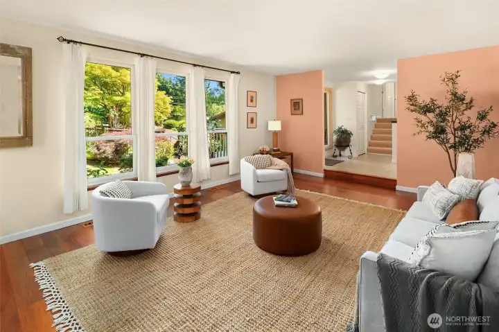 Looking back through the living room towards the entry. Huge north-facing windows provide views of the entry gardens.